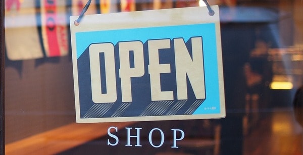 Shop with Open sign hanging on the door